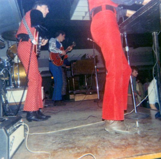 Jack Hamilton (with polka dots), Rich Burman on guitar, John Cascella's legs and boots