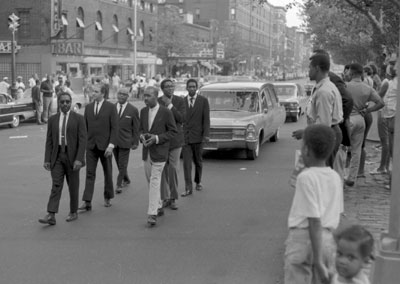 Bud Powell's pallbearers: on right, back to front, Kenny Dorham, Willie Jones, unknown; on left, unknown, Tony Scott, unknown.