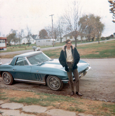 Terry 'Fuzzy' Johnson in front of his Corvette, 1967