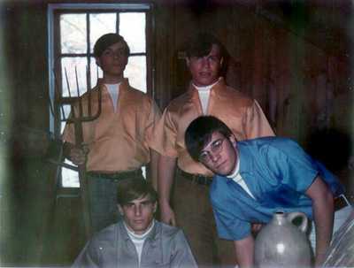 Steve Morse (yellow shirt and pitchfork), Gary Lamperelli (yellow shirt), Dave Lemieux (gray shirt, kneeling) and John Coggeshall (blue shirt and jug)