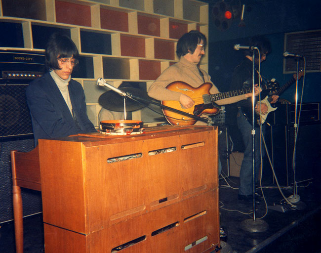 Scrugg on stage, left to right: Chris, Henry (hidden on drums), Jack and John